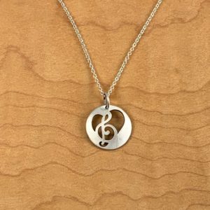 A necklace adorned with a Treble Clef Pendant.