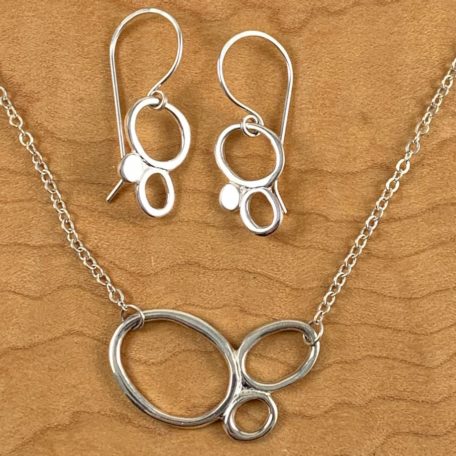 A set consisting of a sterling silver necklace and Tiny Pebble Earrings.