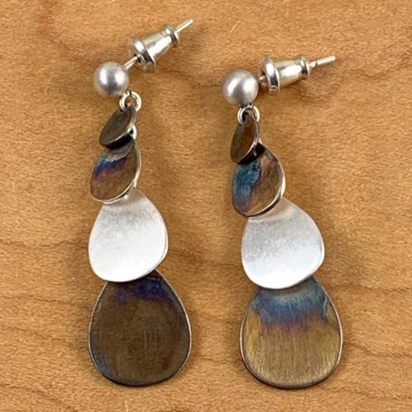 A stunning pair of 4-Tier Cascade earrings featuring a blue and silver color.