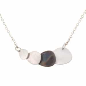 A Luminous Light Necklace with a black and white stone.